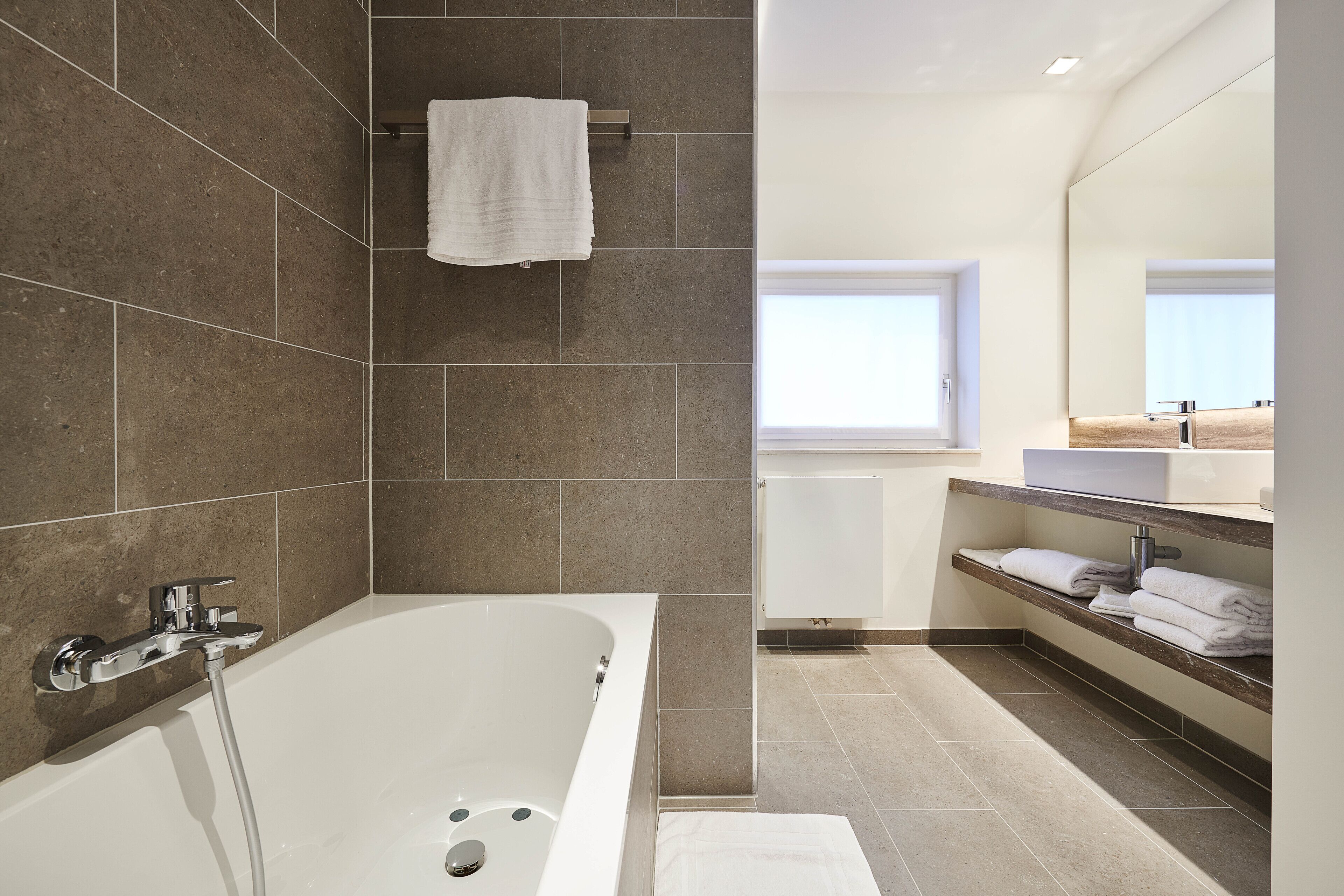 junior suite, 1 king bed, non smoking, jetted tub | bathroom | free toiletries, hair dryer, bathrobes, slippers