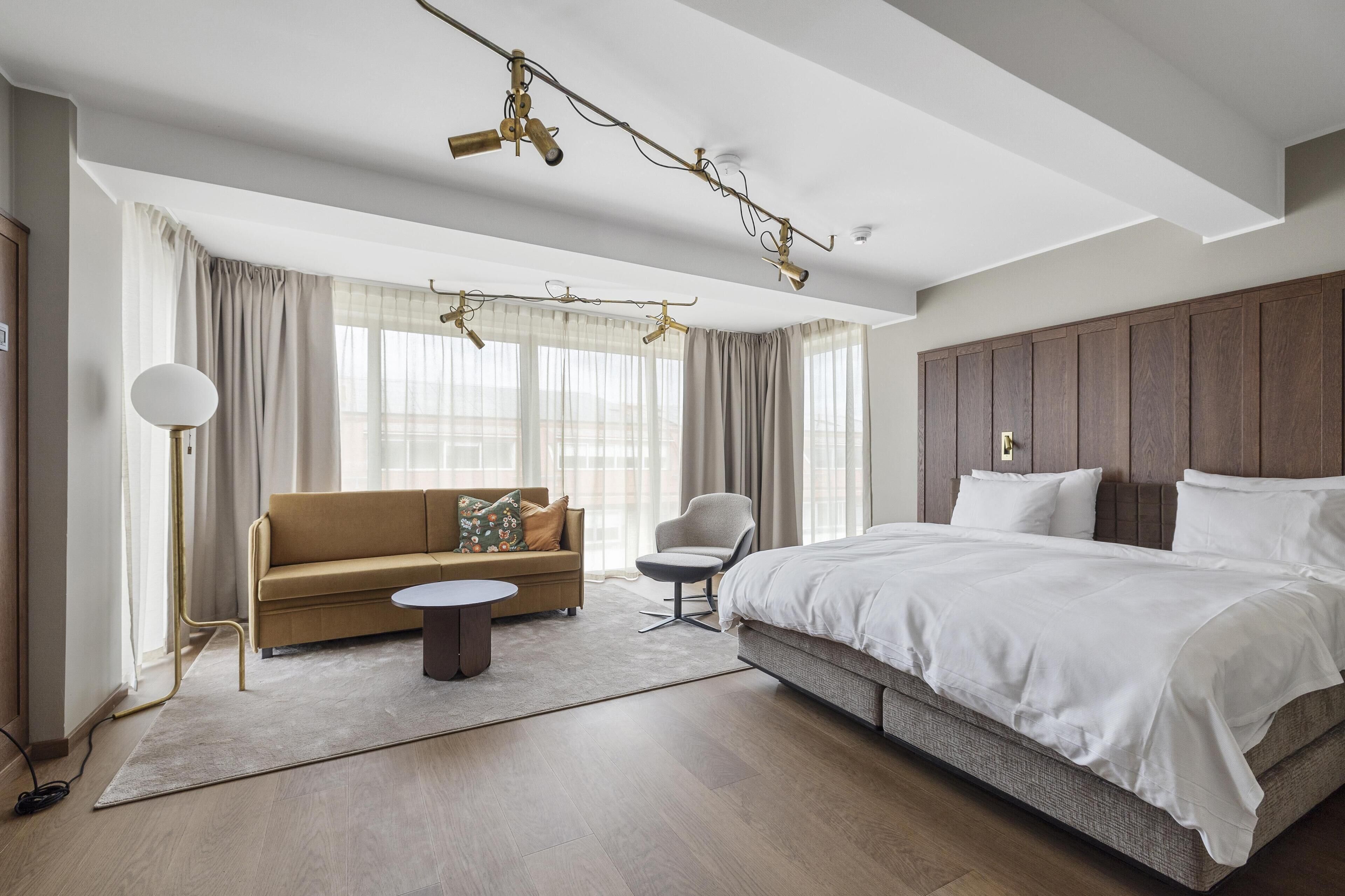 Junior Suite, 1 King Bed, Non Smoking (with Sofabed) | In-room safe, blackout drapes, soundproofing, iron/ironing board