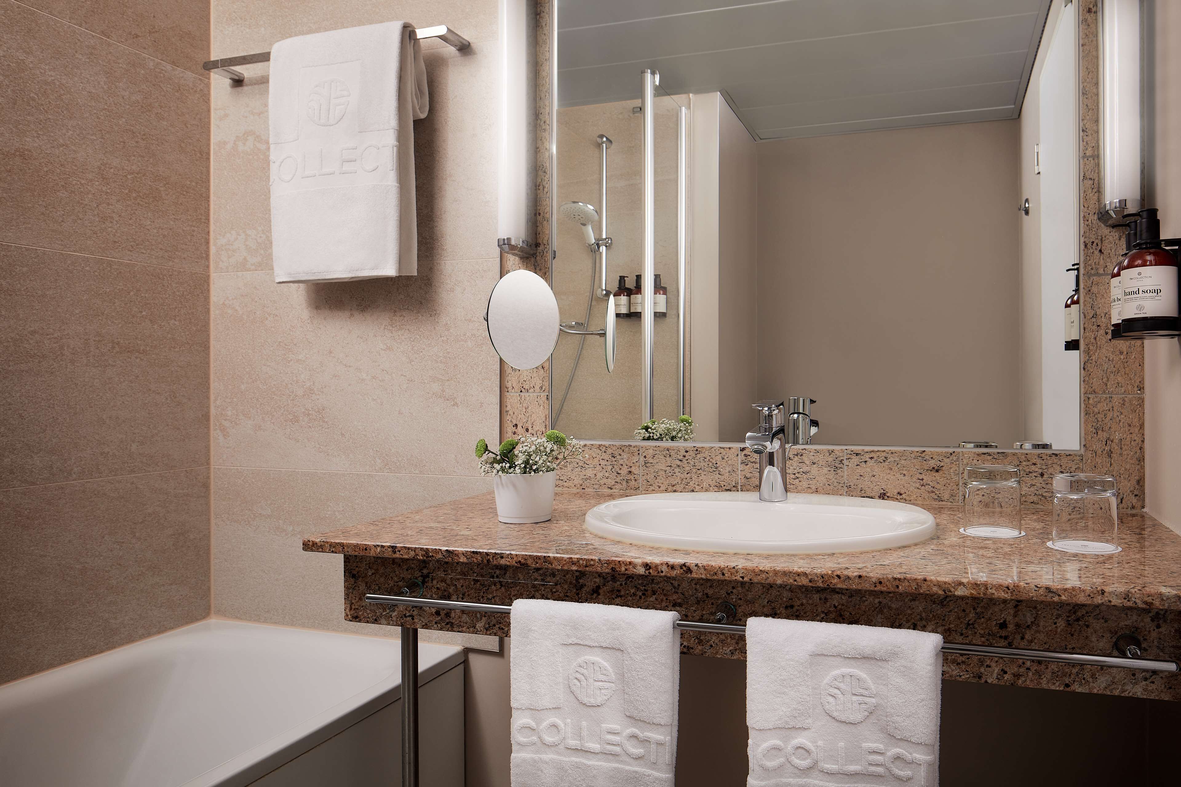 eco-friendly toiletries, hair dryer, towels