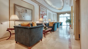 A spacious lobby with a grand chandelier, elegant sofas, and a large painting on the wall. - Hotel Roger de Lluria Barcelona (Barcelona)