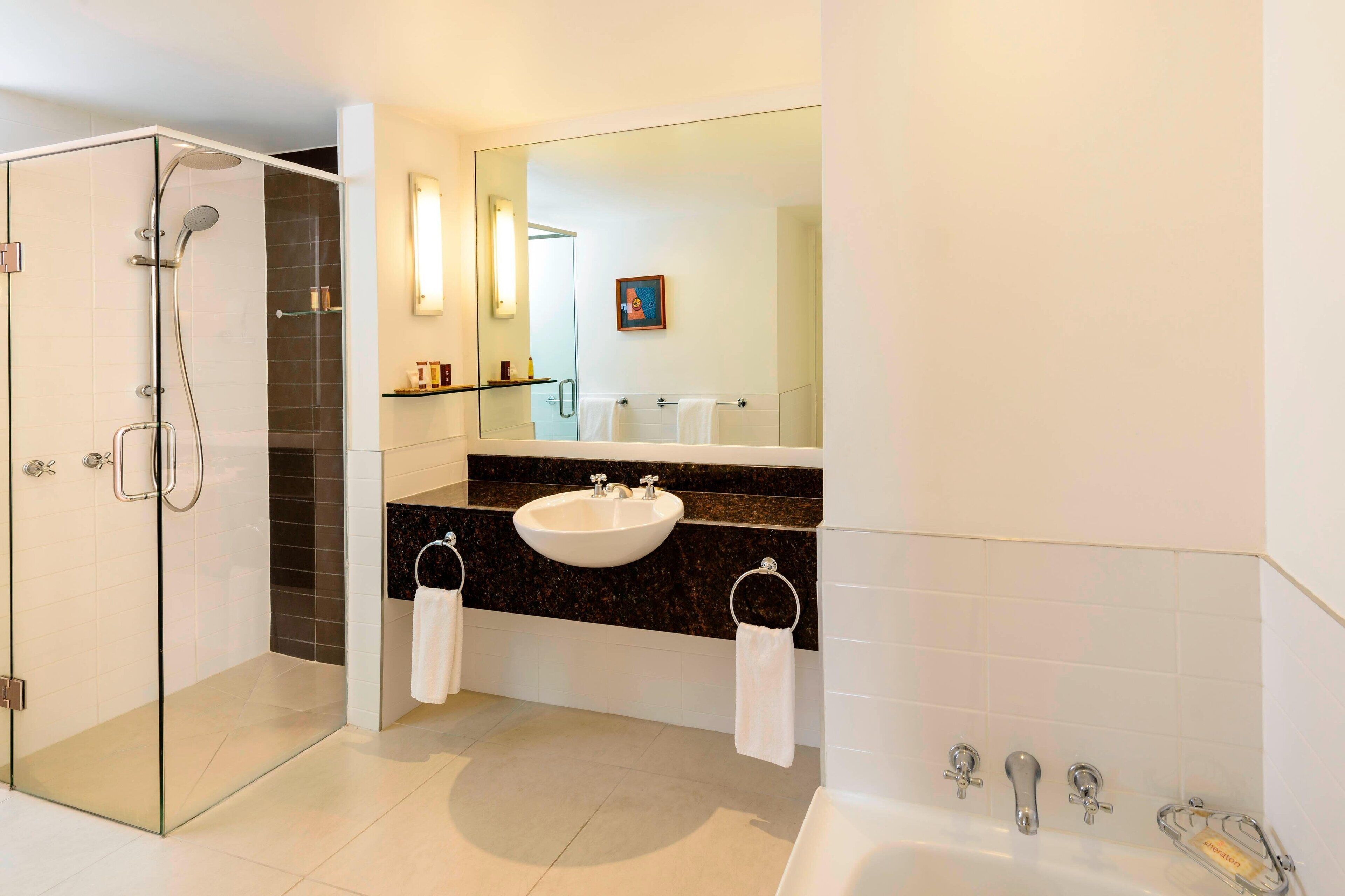 separate bathtub and shower, designer toiletries, hair dryer, bathrobes