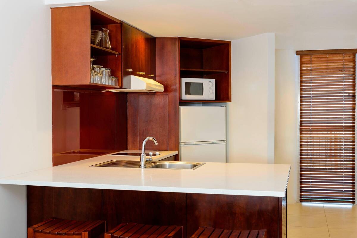 full-sized fridge, microwave, stovetop, dishwasher