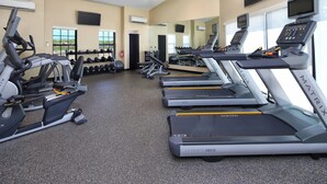 A gym with treadmills, weight machines, and dumbbells. - TownePlace Suites by Marriott Tucson (Tucson)