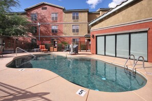 Outdoor pool, open 7:00 AM to 10:00 PM, pool umbrellas