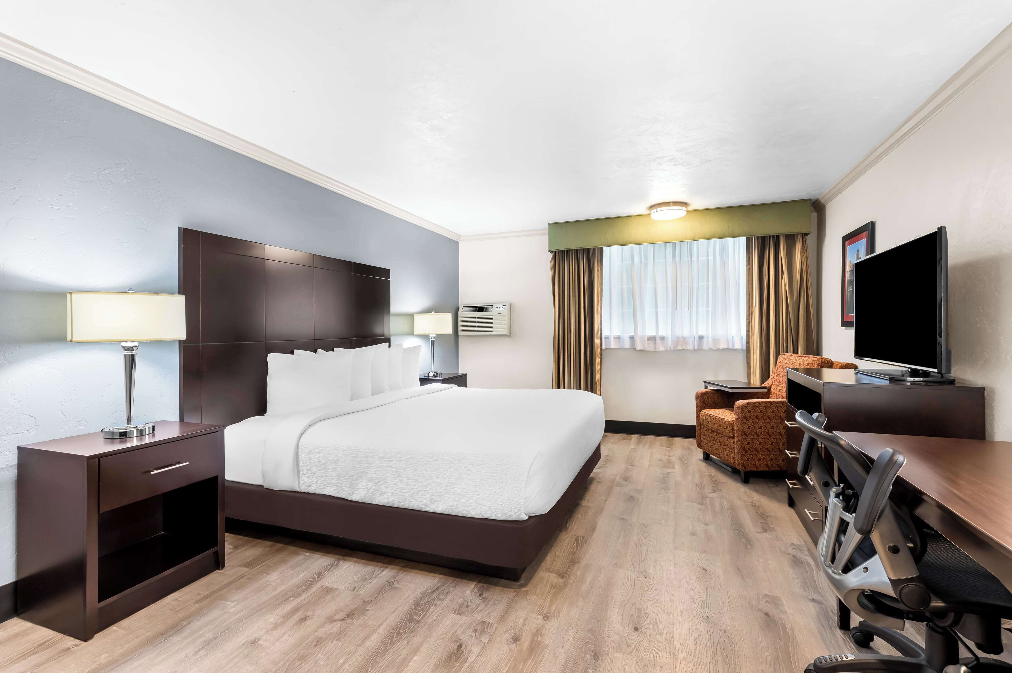 premium bedding, desk, laptop workspace, iron/ironing board