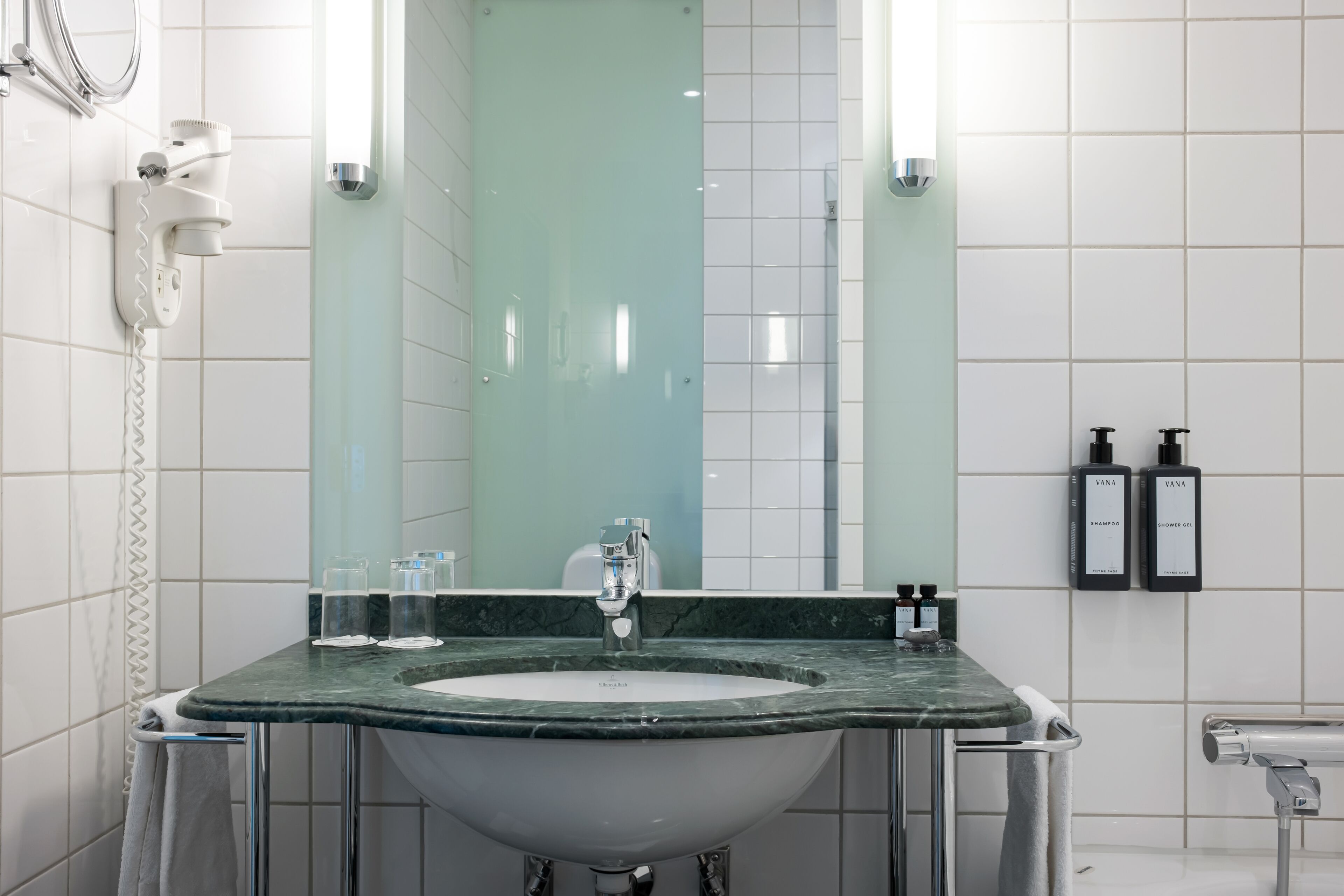 deluxe executive room | bathroom | hair dryer, towels