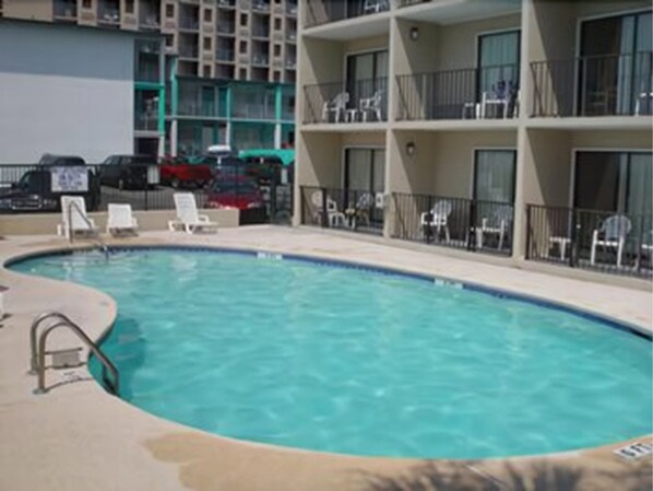 Seasonal outdoor pool, pool loungers