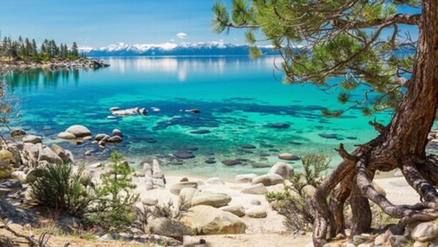 A clear lake with visible rocks and trees. - Quality Inn South Lake Tahoe (South Lake Tahoe)