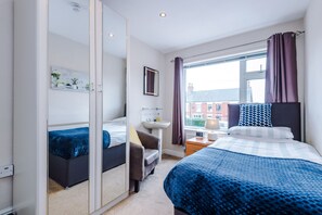 Premium Single Room, Shared Bathroom | 1 bedroom, desk, blackout curtains, iron/ironing board