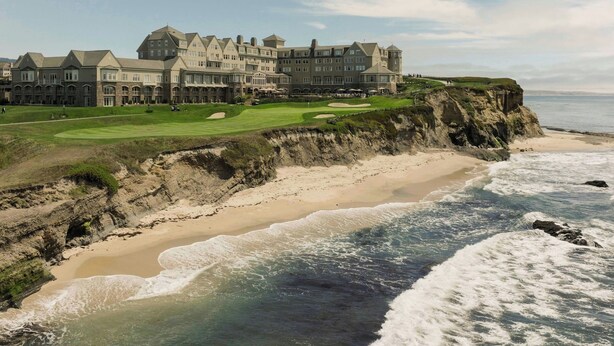 A large, multi-story hotel with a golf course and beach views. - The Ritz-Carlton, Half Moon Bay (Half Moon Bay)