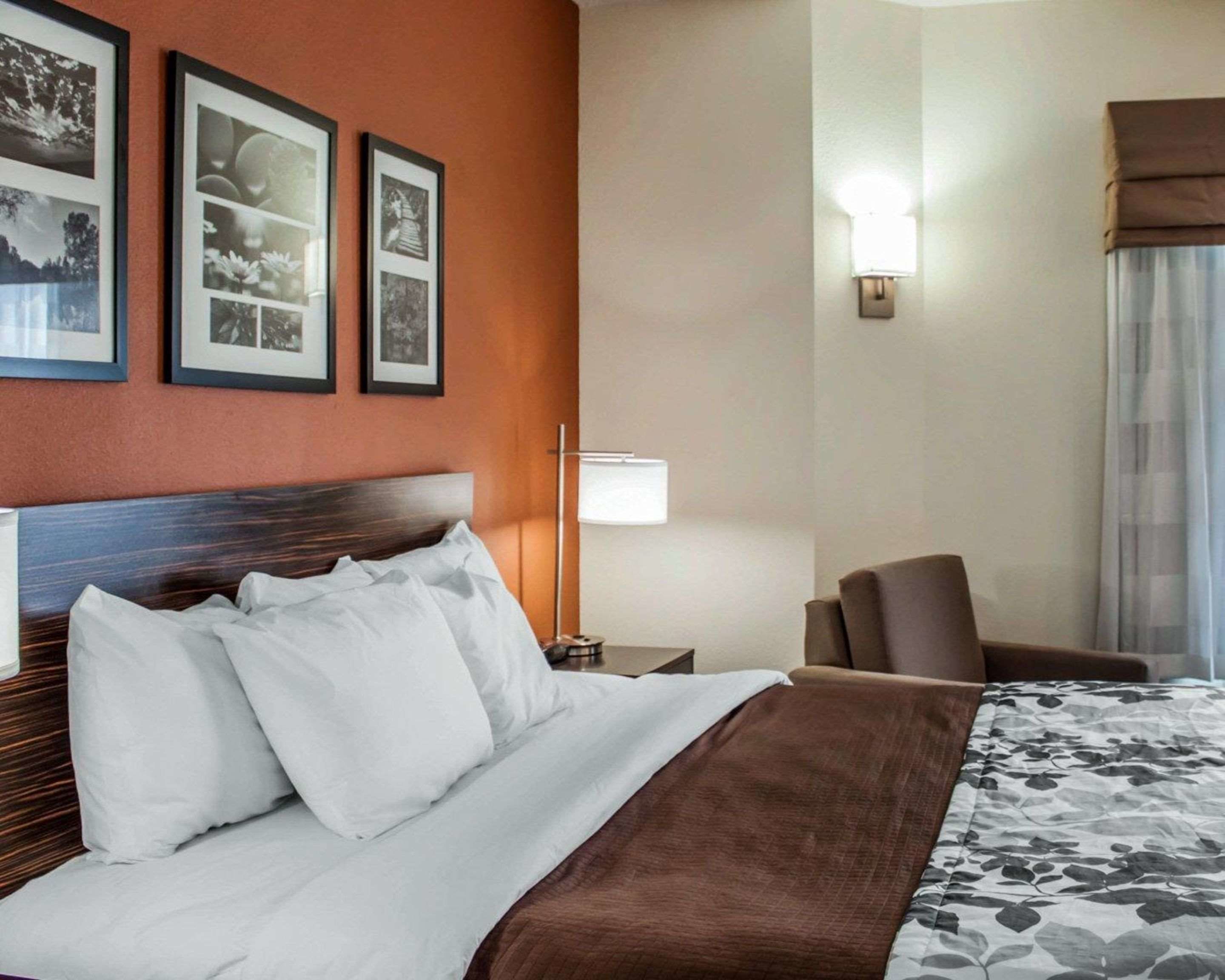 Premium bedding, desk, laptop workspace, blackout drapes