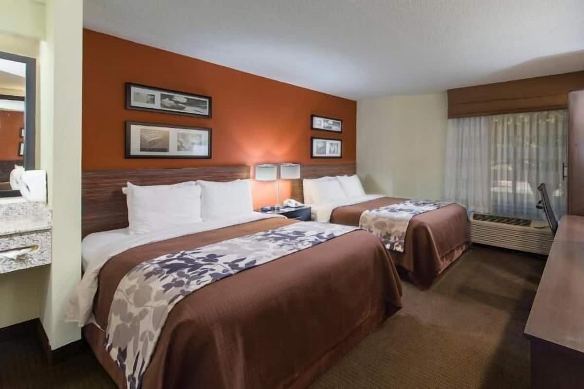 Premium bedding, desk, laptop workspace, blackout curtains