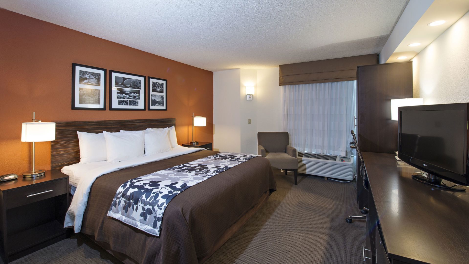 Premium bedding, desk, laptop workspace, blackout curtains