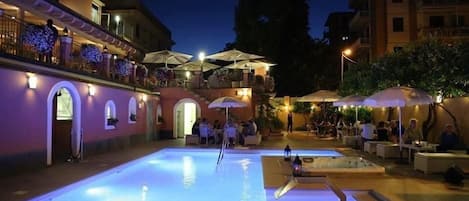 Outdoor pool, open 9:00 AM to 7:00 PM, pool umbrellas, pool loungers