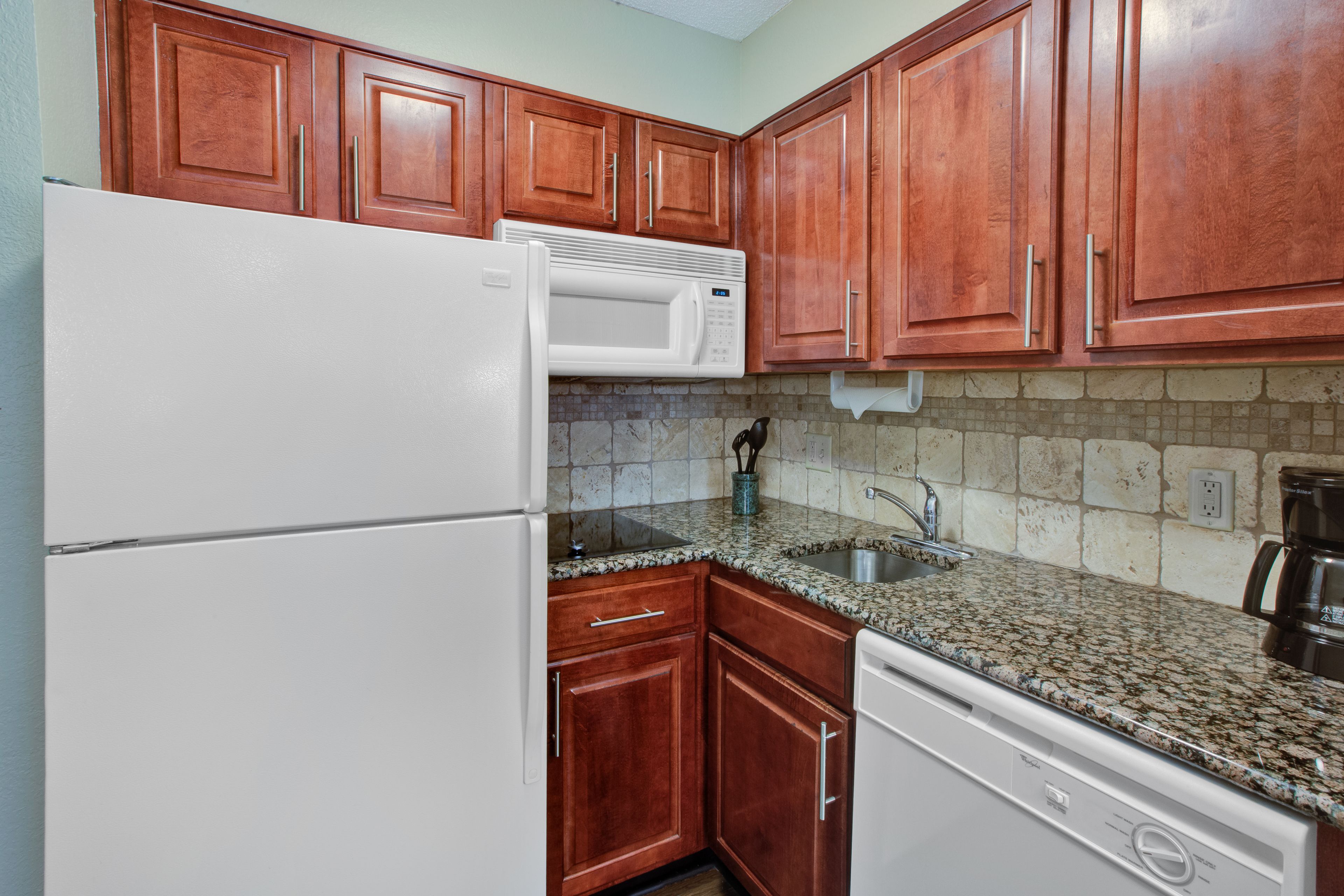 full-sized fridge, microwave, dishwasher, coffee/tea maker