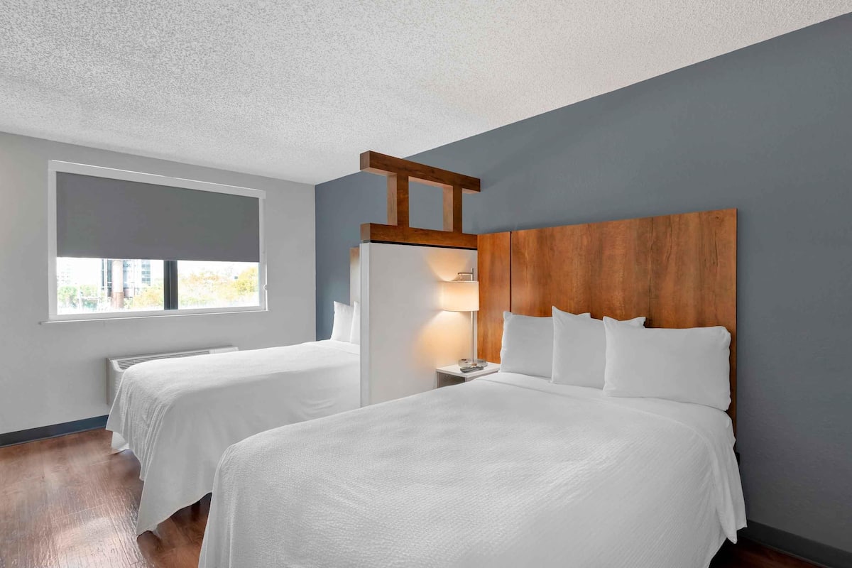 Premium bedding, desk, laptop workspace, iron/ironing board