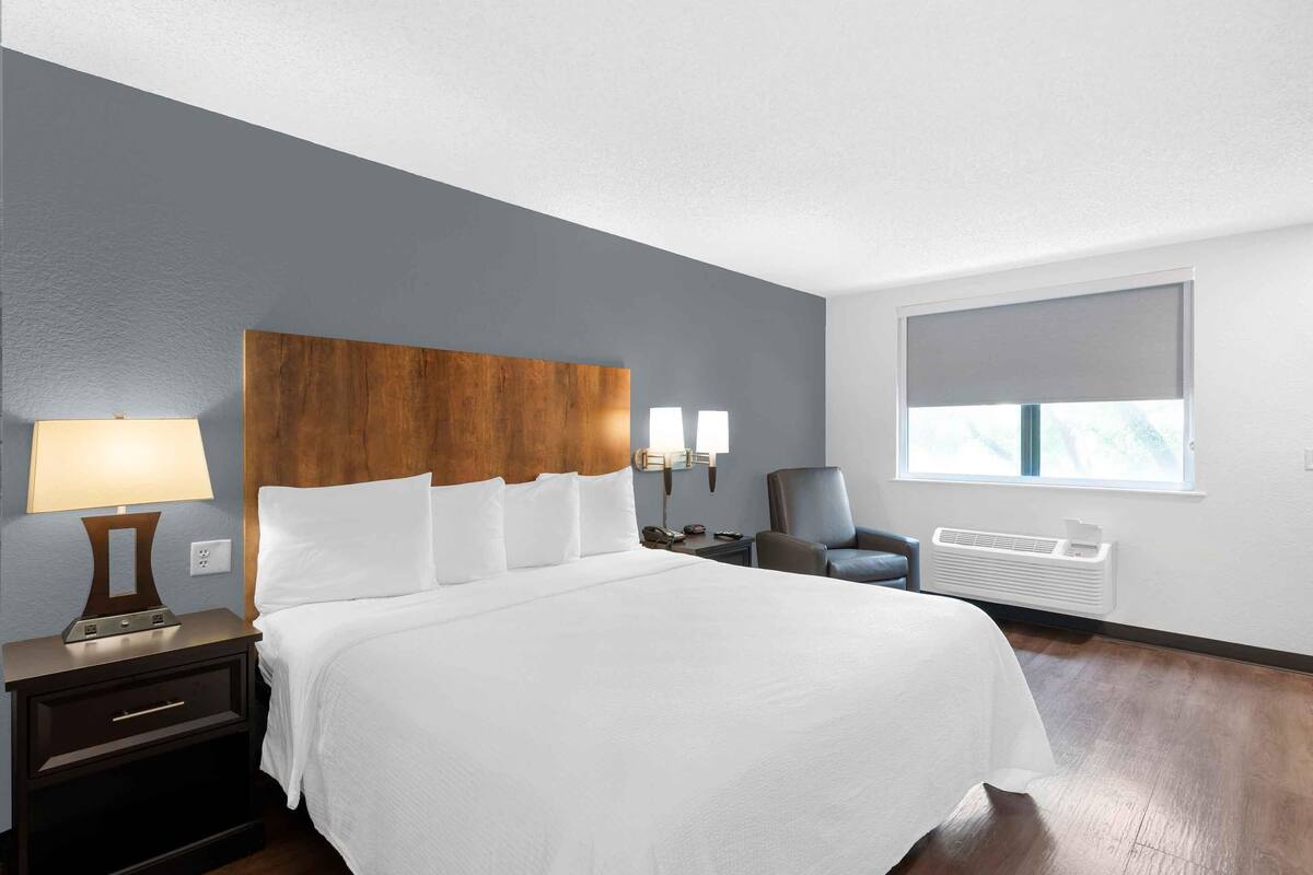 Premium bedding, desk, laptop workspace, iron/ironing board