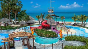 A water park with slides and a pirate-themed sign. - Beaches Negril Resort - ALL INCLUSIVE (Negril)