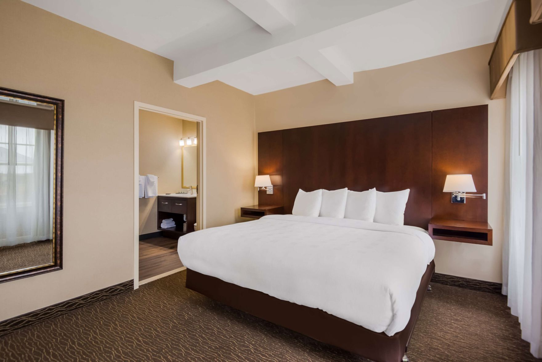 Premium bedding, pillow-top beds, desk, laptop workspace