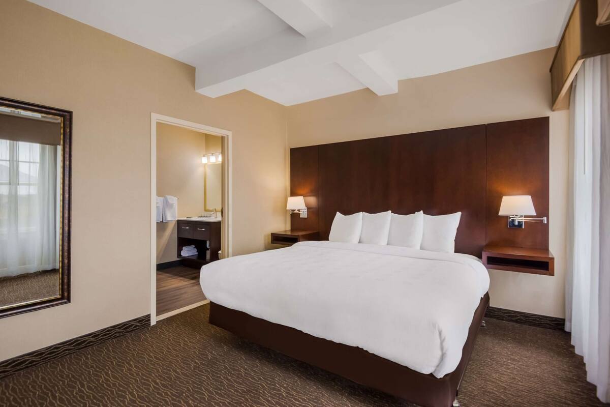 Premium bedding, pillow-top beds, desk, laptop workspace
