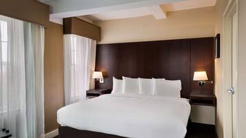 Premium bedding, pillow-top beds, desk, laptop workspace