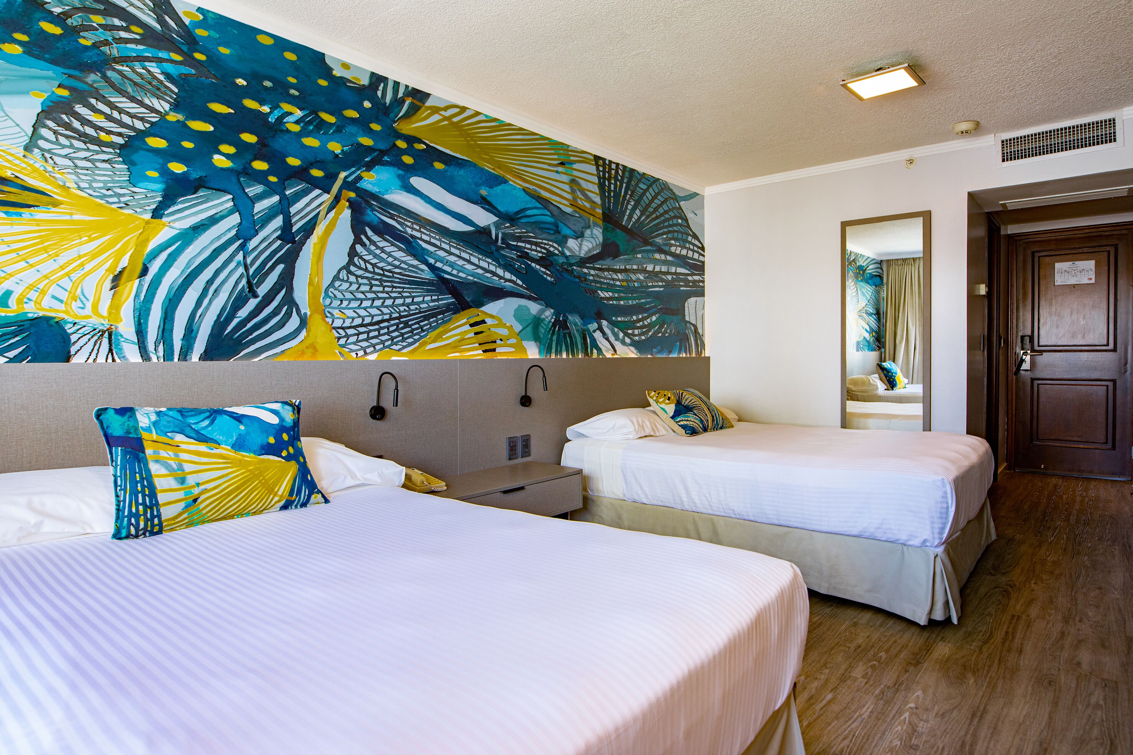 family room, 2 double beds | minibar, in-room safe, desk, iron/ironing board