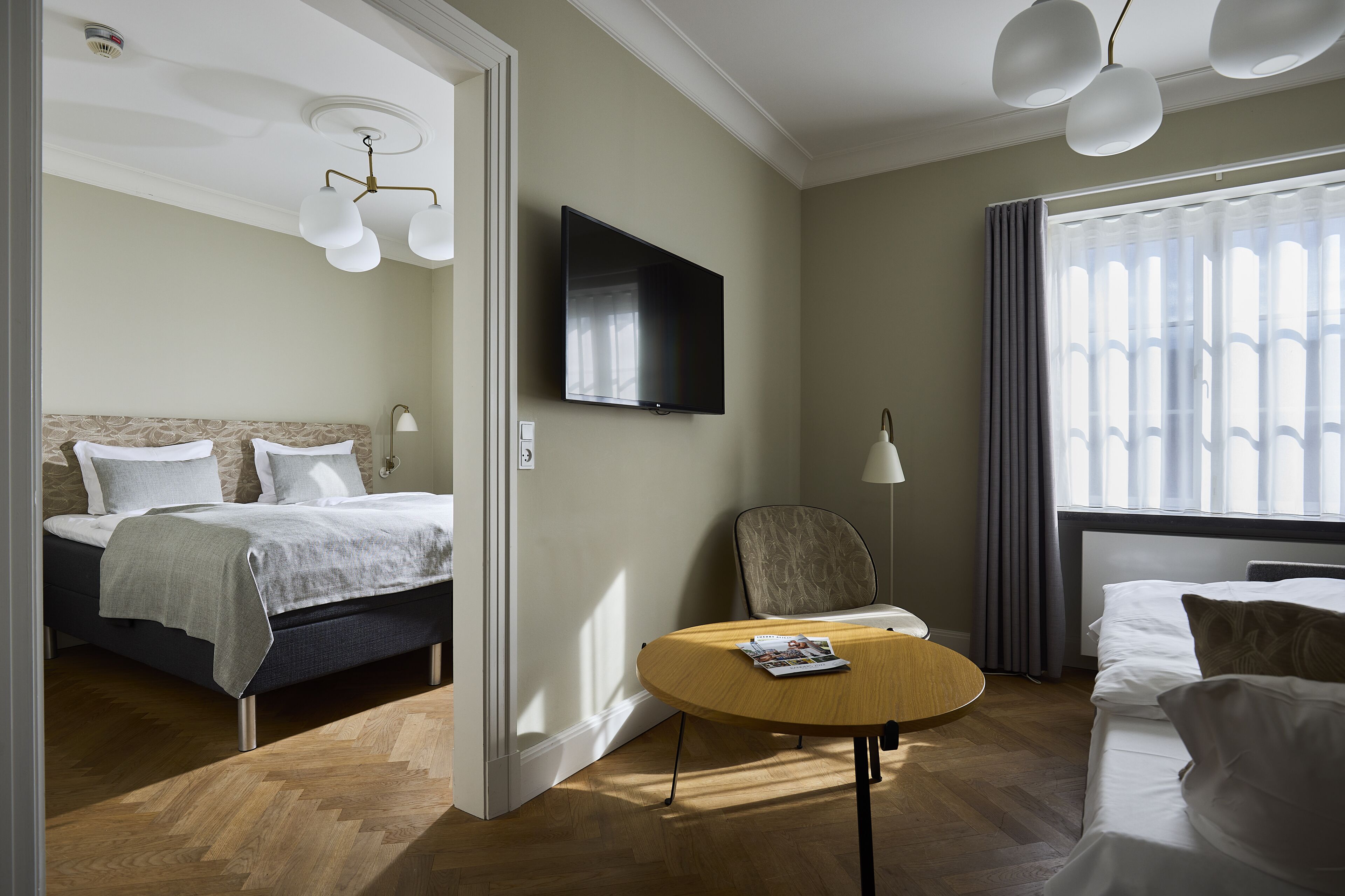 exclusive quadruple room | down duvets, minibar, in-room safe, individually decorated