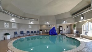 An indoor swimming pool with clear signage, a pool lift, and lounge chairs around the perimeter. - Holiday Inn Express and Suites Oklahoma City Northwest by IHG (Oklahoma City)