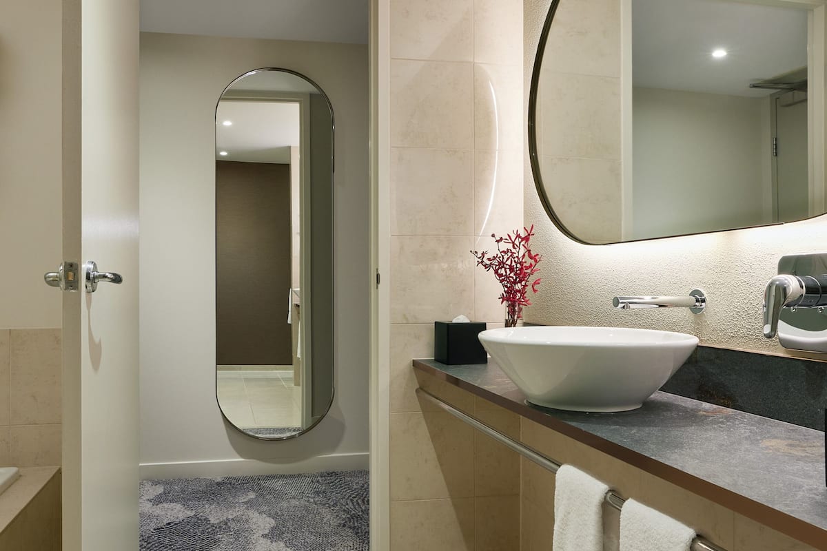 superior twin room - runway view | bathroom | separate bathtub and shower, free toiletries, hair dryer, bathrobes