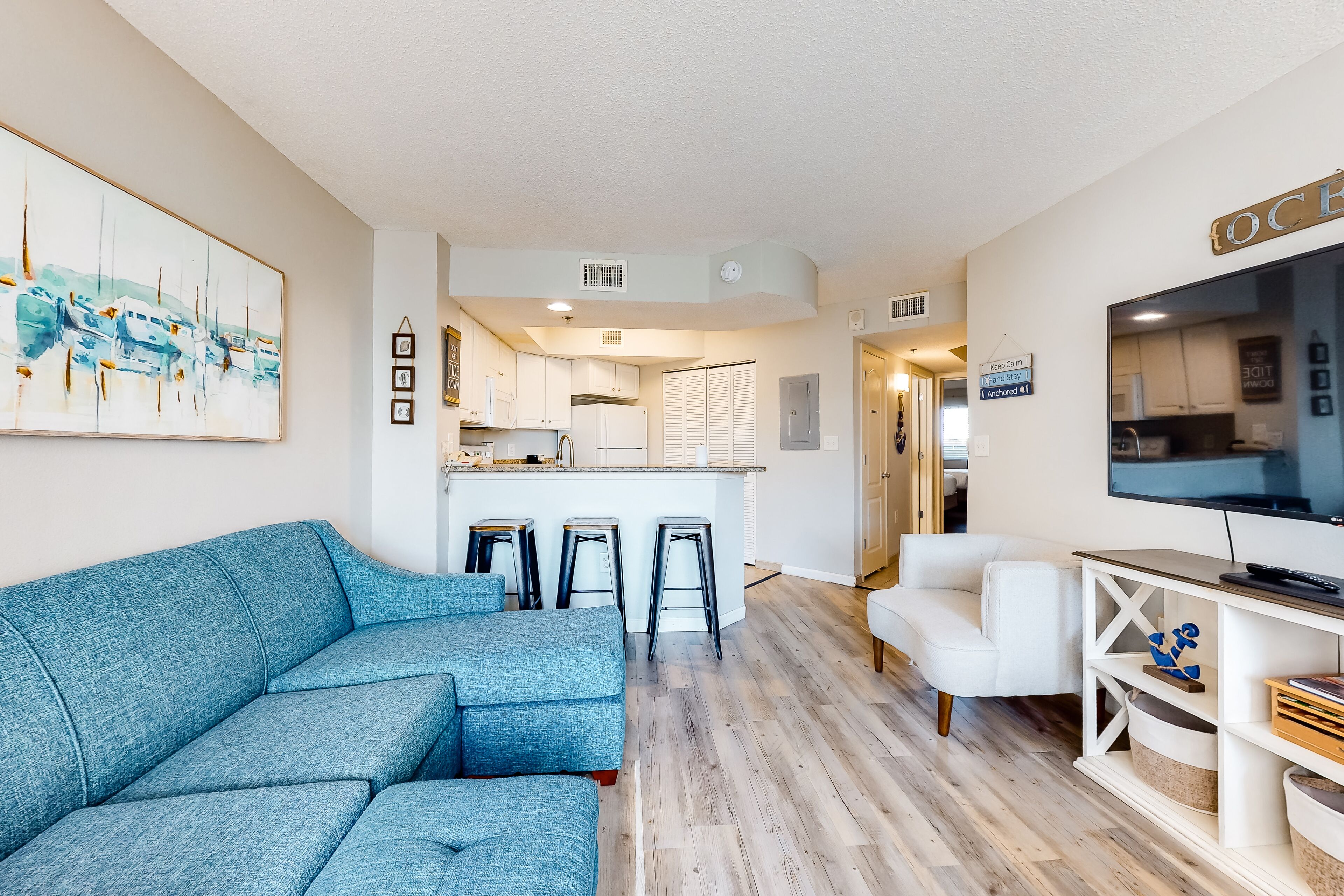 Condo, 1 Bedroom (Deluxe) | Living area | Flat-screen TV, DVD player