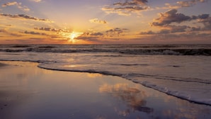 A beach with waves at sunset. - Marriott's Barony Beach Club (Hilton Head Island)