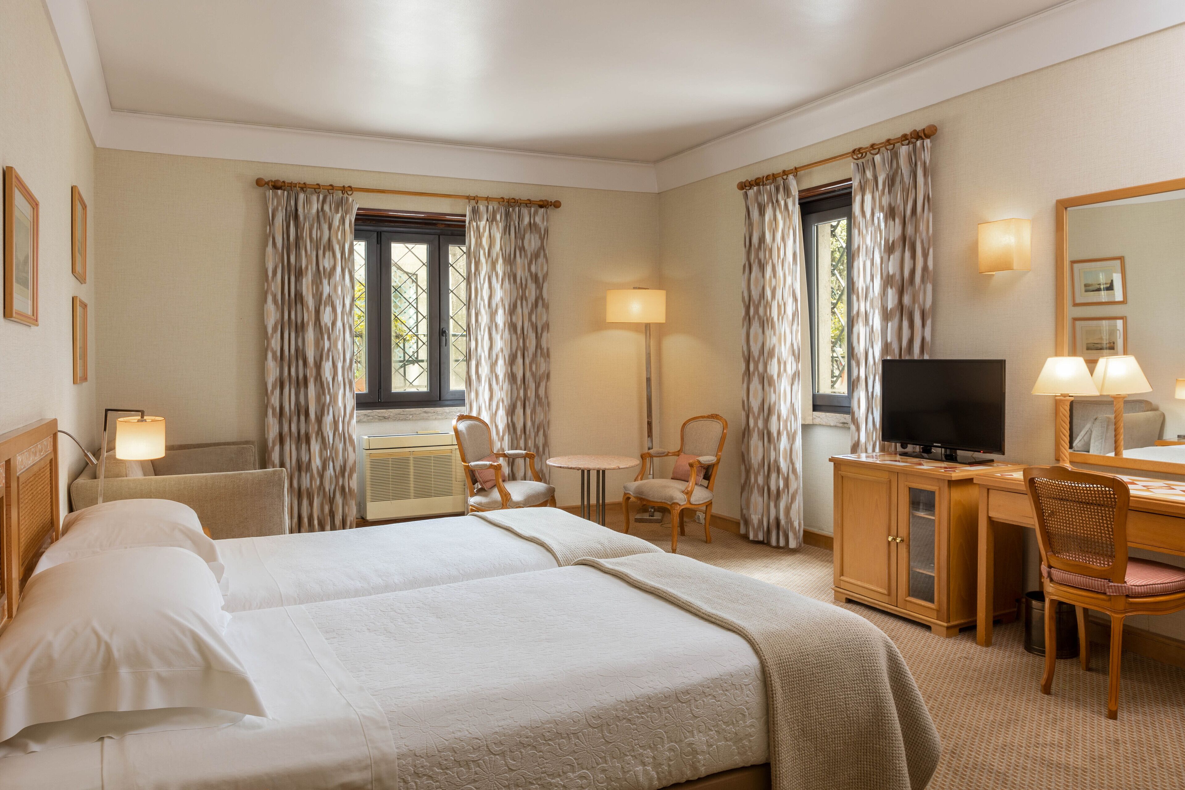 family room | minibar, in-room safe, desk, blackout curtains