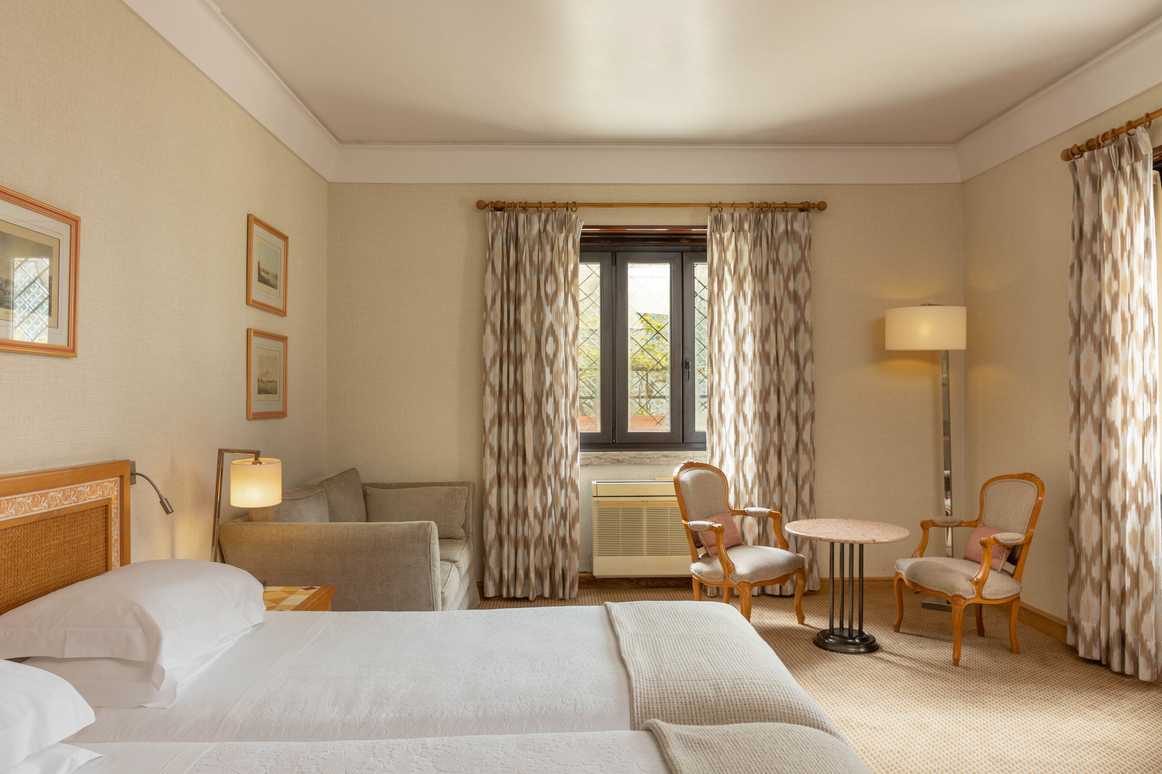 family room | minibar, in-room safe, desk, blackout curtains