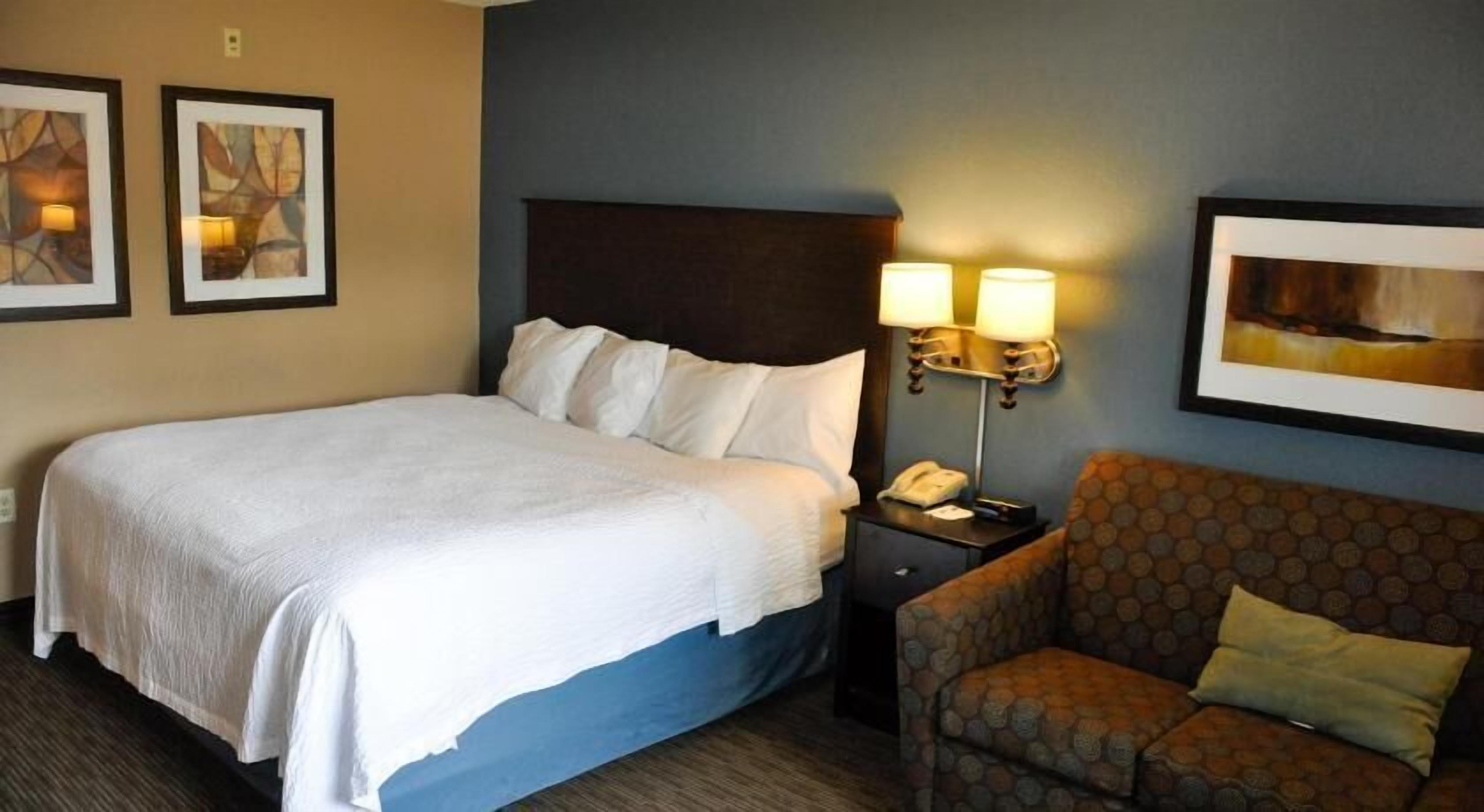 Desk, laptop workspace, blackout drapes, iron/ironing board