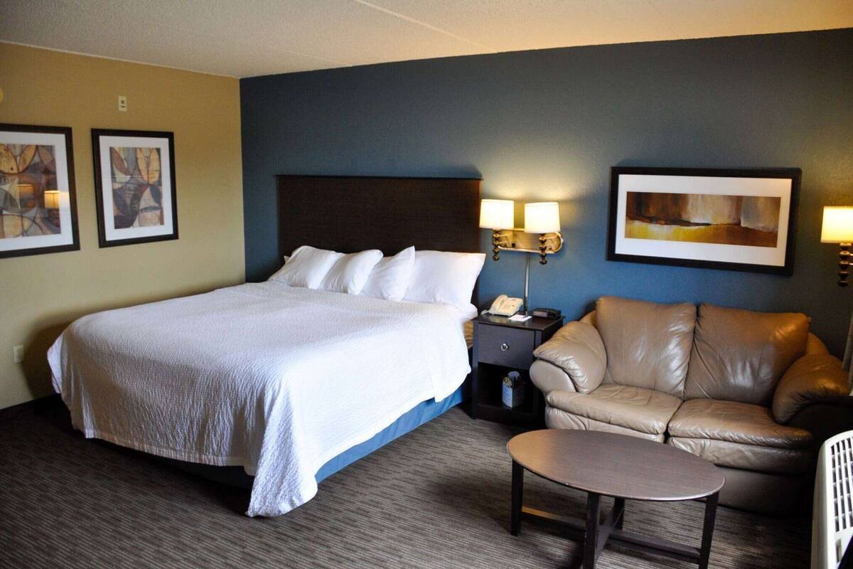 Desk, laptop workspace, blackout drapes, iron/ironing board