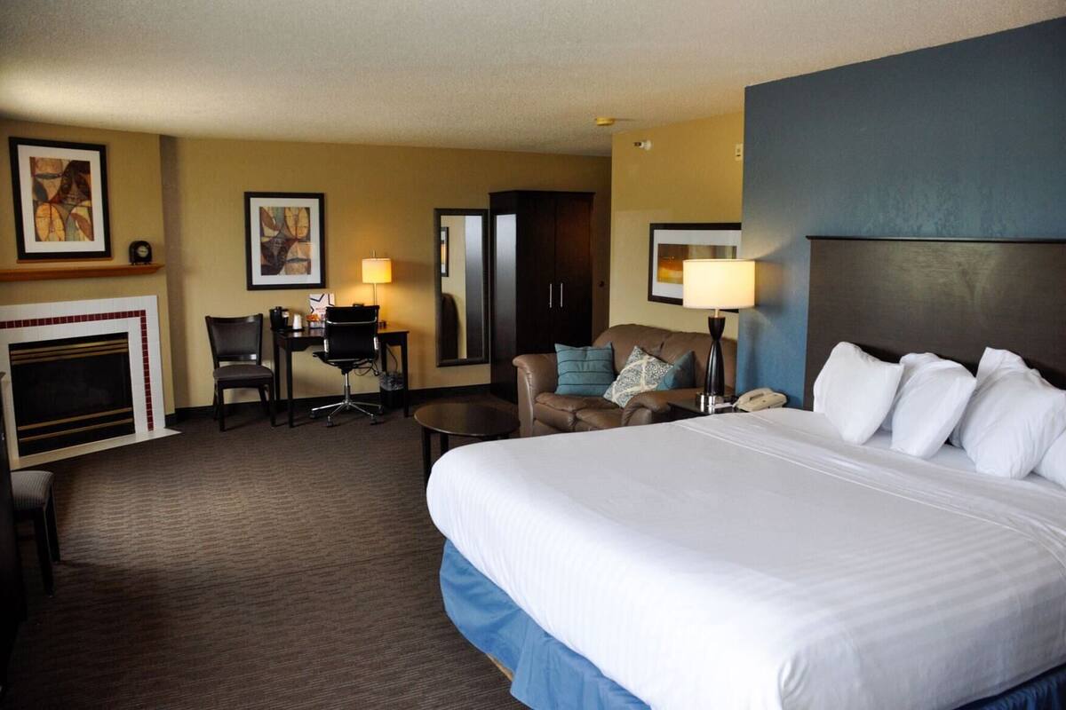 Desk, laptop workspace, blackout drapes, iron/ironing board