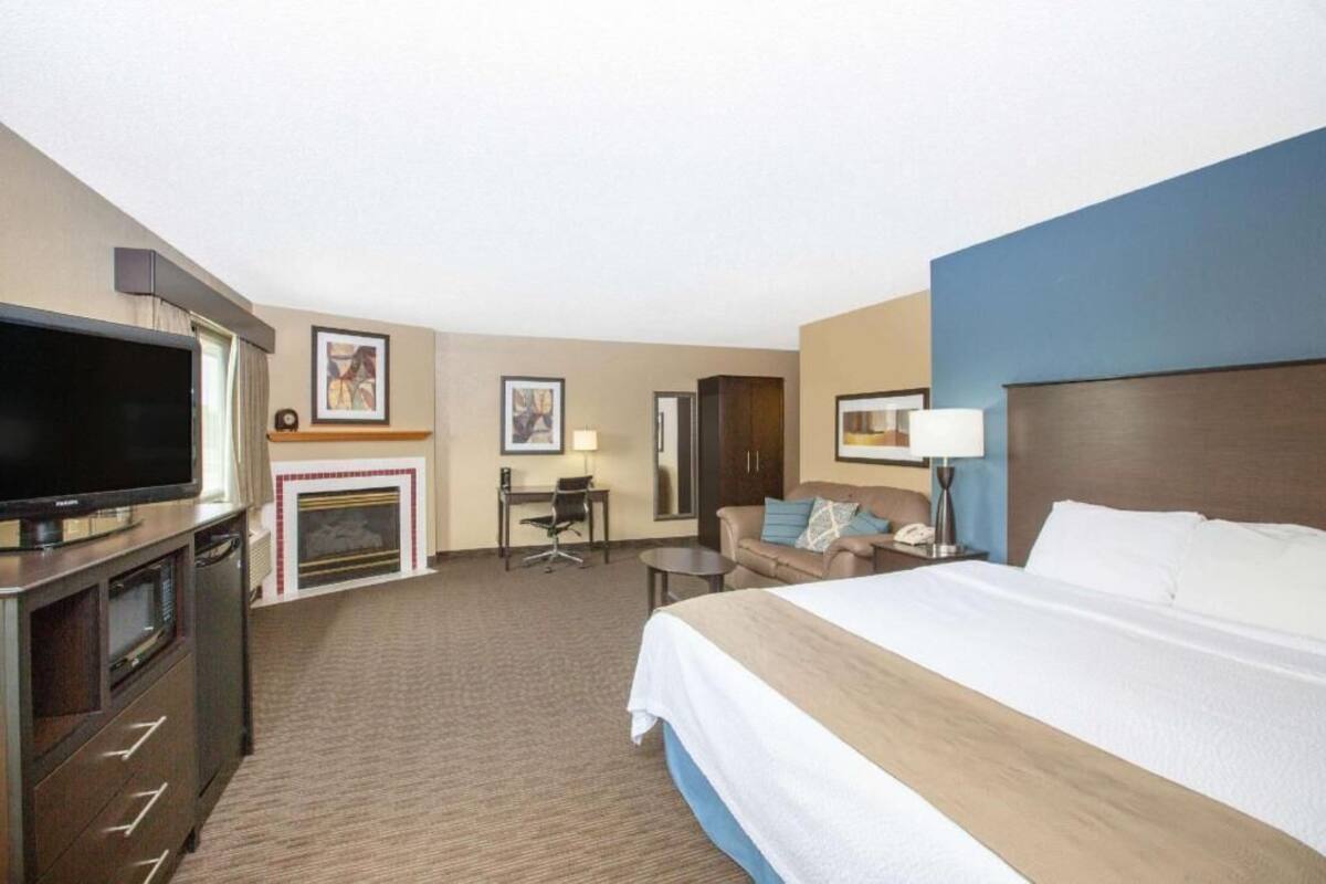 Desk, laptop workspace, blackout drapes, iron/ironing board