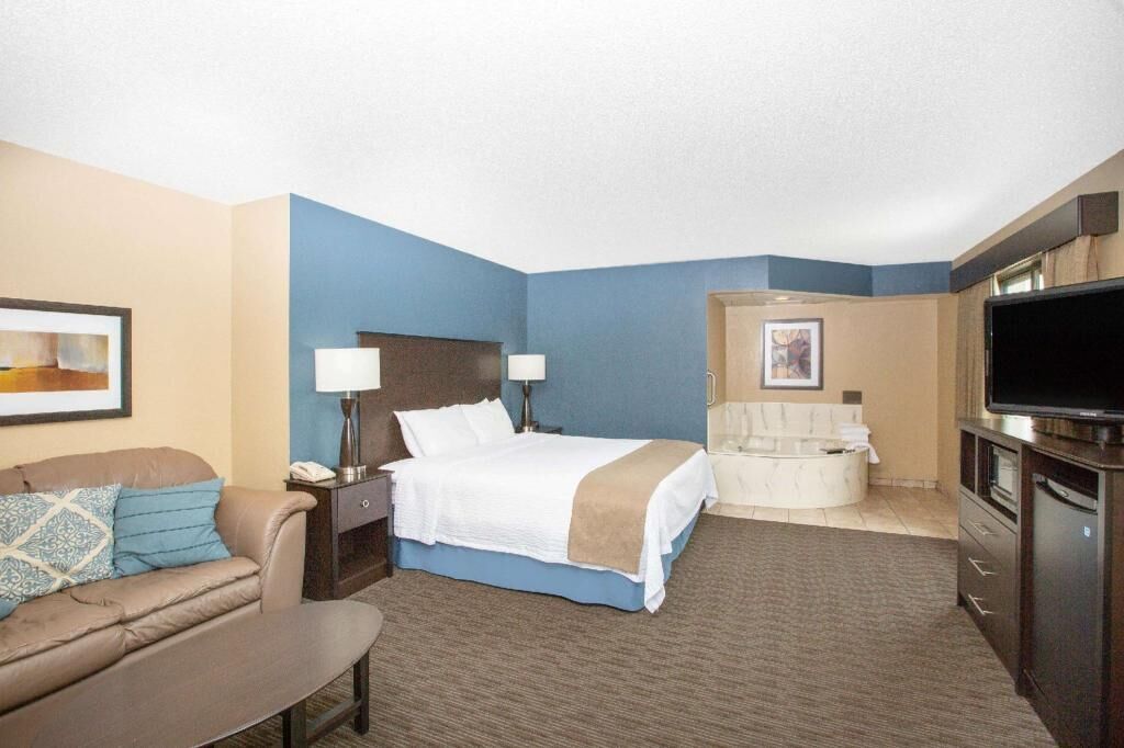 Desk, laptop workspace, blackout drapes, iron/ironing board