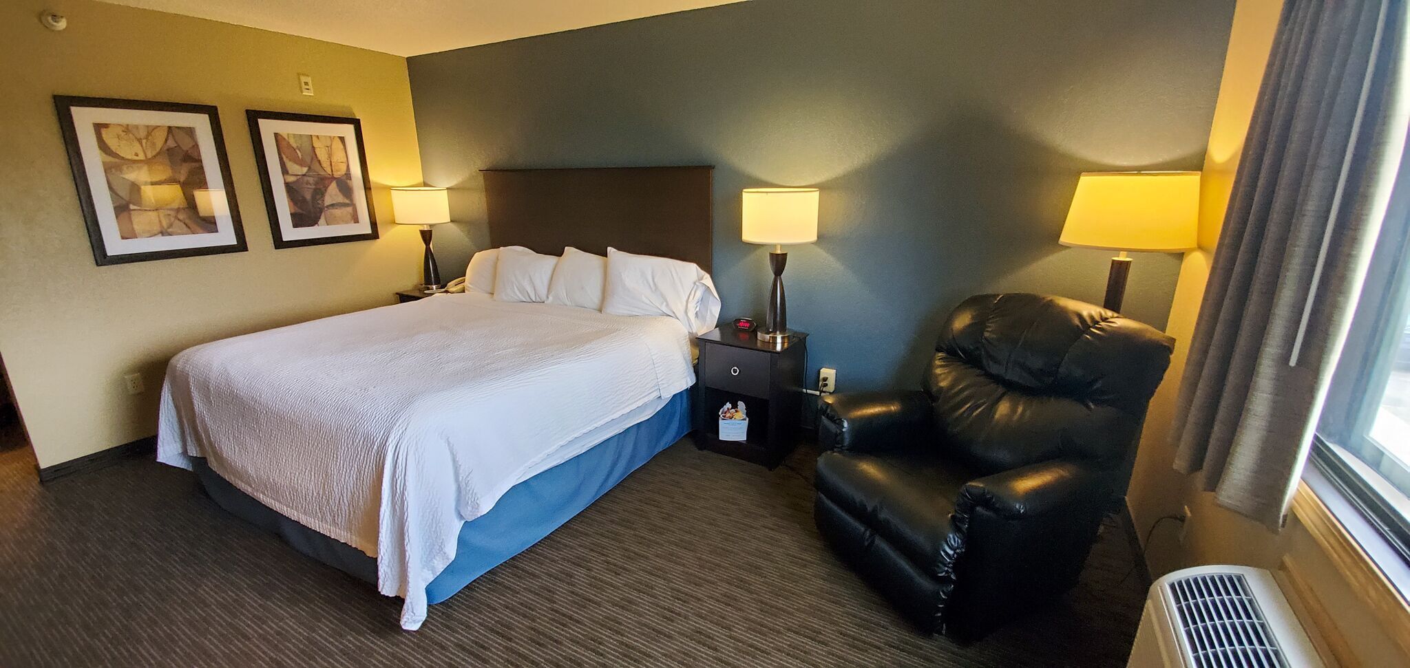 Desk, laptop workspace, blackout drapes, iron/ironing board