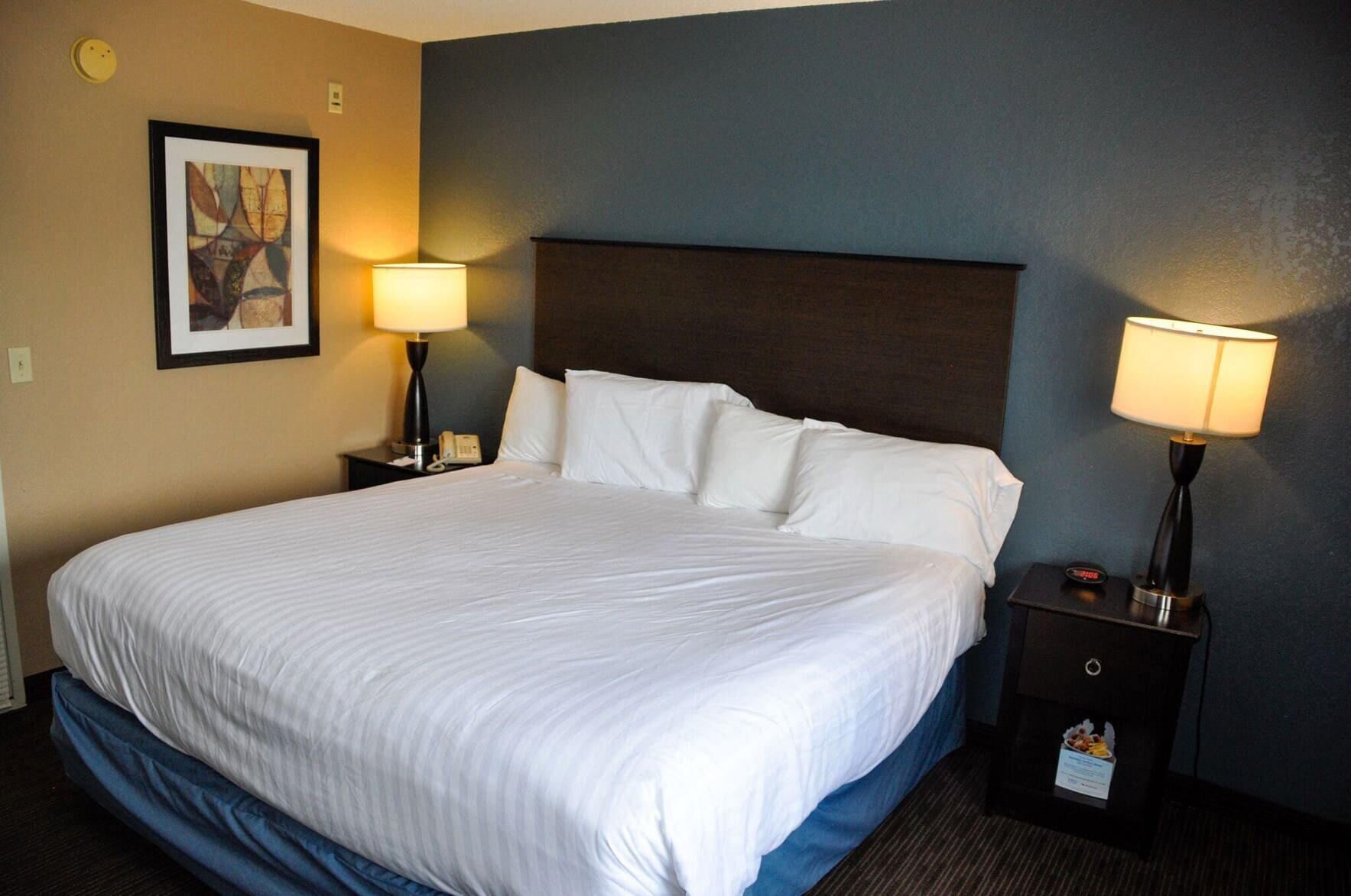 Desk, laptop workspace, blackout drapes, iron/ironing board