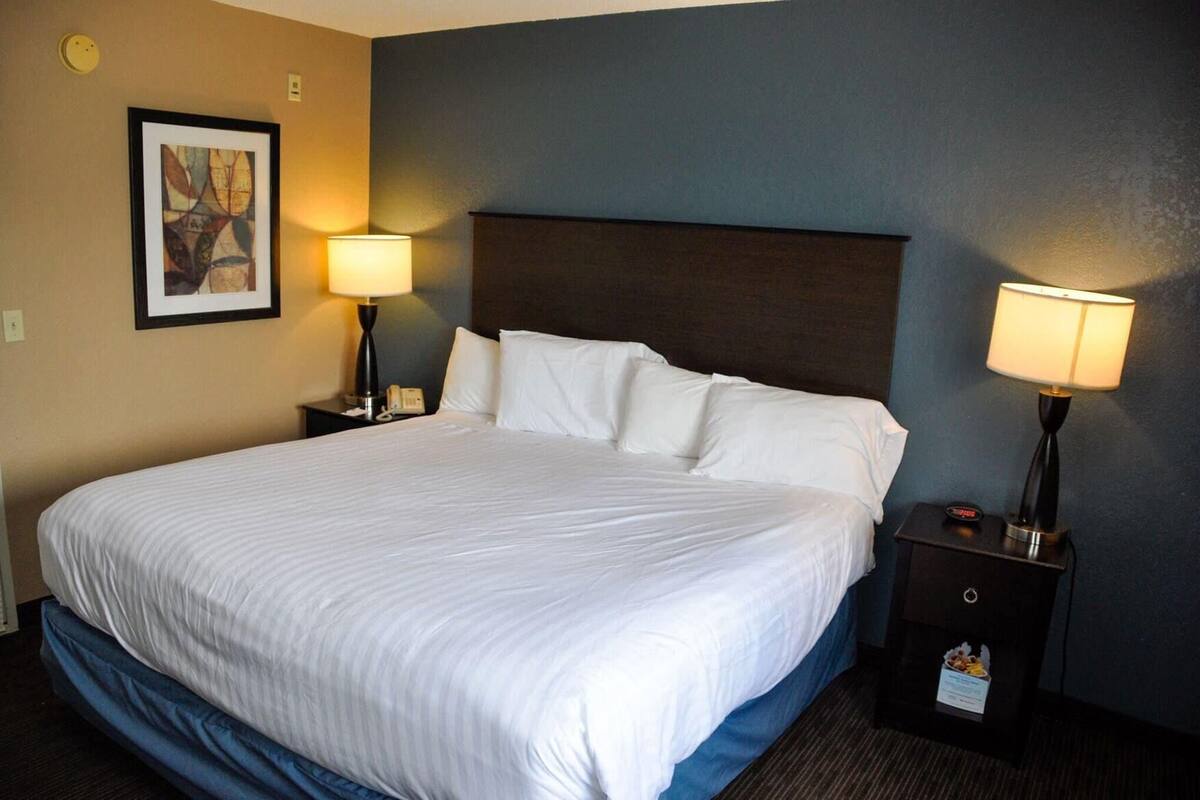 Desk, laptop workspace, blackout drapes, iron/ironing board