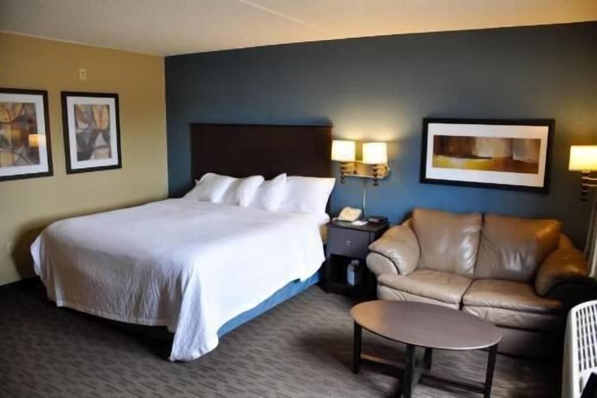 Desk, laptop workspace, blackout drapes, iron/ironing board