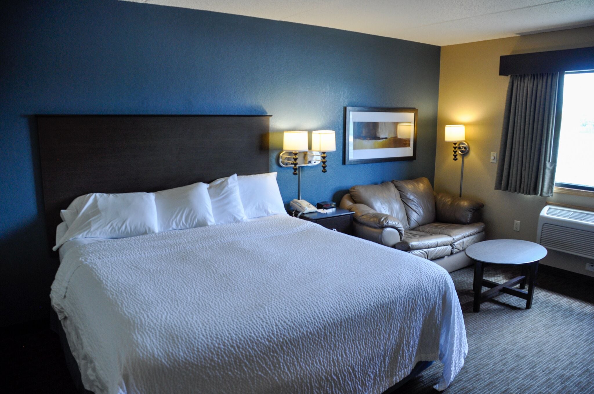 superior studio suite, 1 king bed, non smoking | desk, laptop workspace, blackout curtains, iron/ironing board