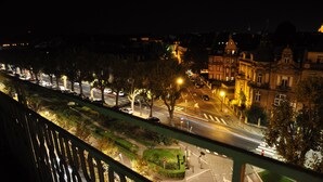 A nighttime cityscape with illuminated streets, a crosswalk, and buildings with classical architecture. - ibis Styles Metz Centre Gare (Metz)