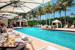 Outdoor pool, open 6:00 AM to 11:00 PM, free cabanas, pool umbrellas