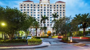 A multi-story hotel with a prominent 'Renaissance Hotel' sign, surrounded by palm trees and a well-maintained landscape. - Renaissance Fort Lauderdale Marina Hotel (Fort Lauderdale)