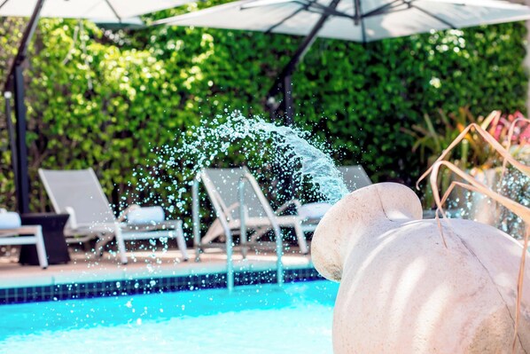 Outdoor pool, open 6:00 AM to 11:00 PM, free pool cabanas
