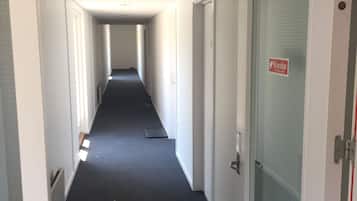 Habitación individual | Área de sala de estar | Televisión