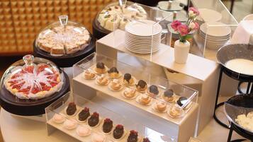 A dessert display with various pastries and cakes.