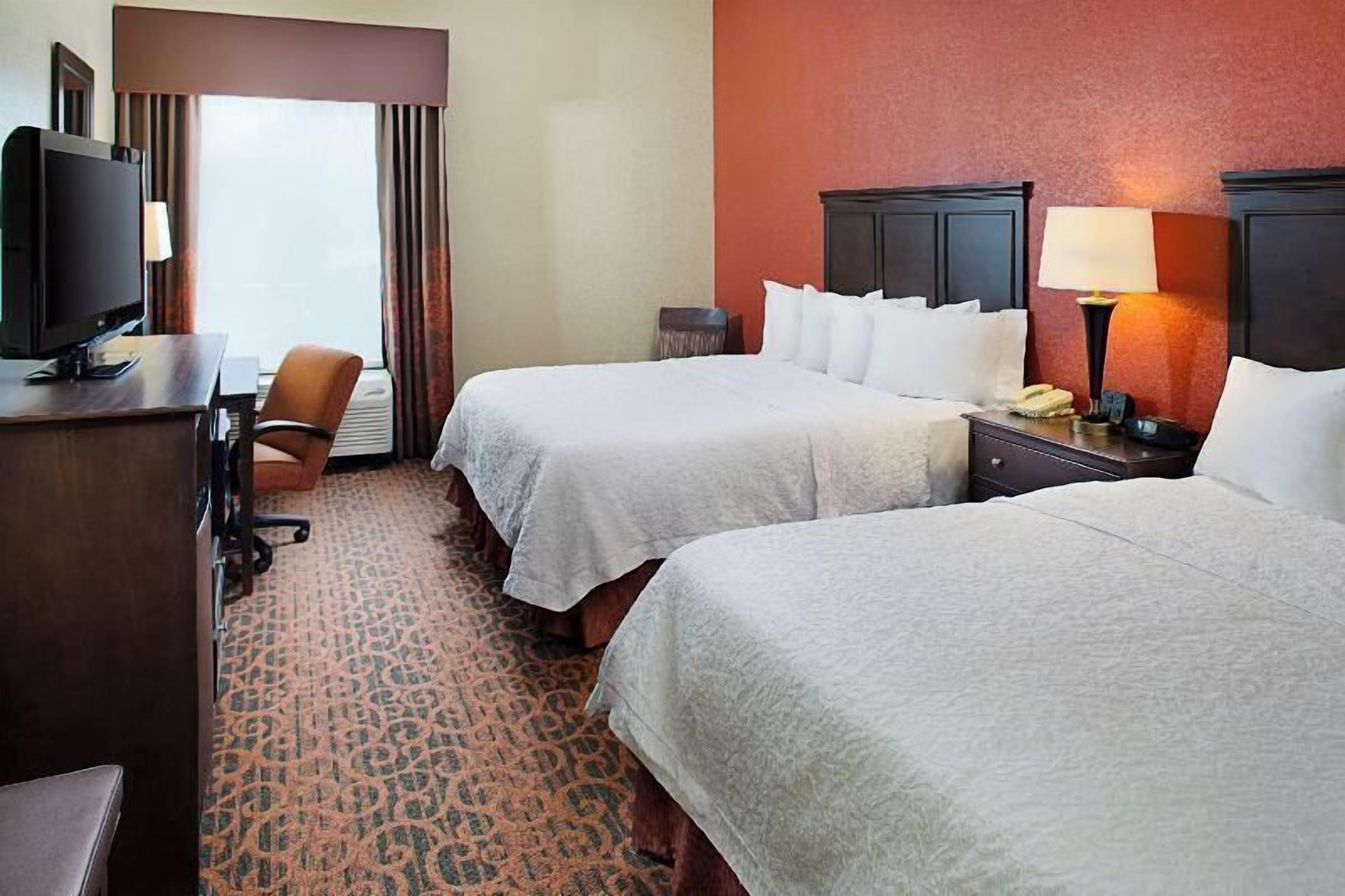 Premium bedding, desk, laptop workspace, blackout curtains